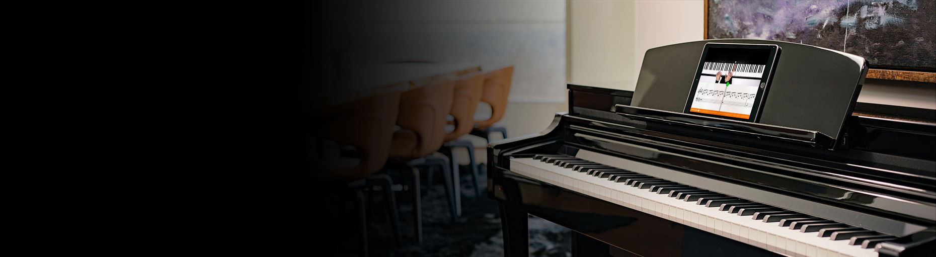 Yamaha Clavinova digital piano in a modern setting with interactive display, emphasizing innovation and style.