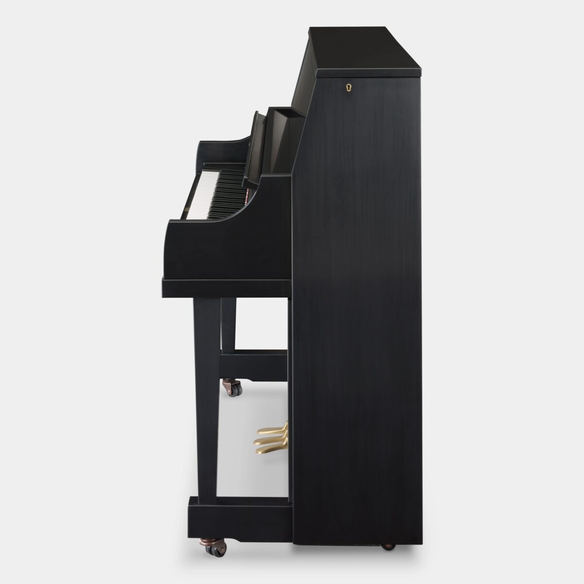 Side view of a polished ebony upright piano showcasing its sleek design and detailed craftsmanship at Las Vegas Pianos.